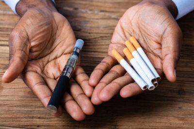 Vape device with smoke comparison concept showing shift from traditional smoking to vaping